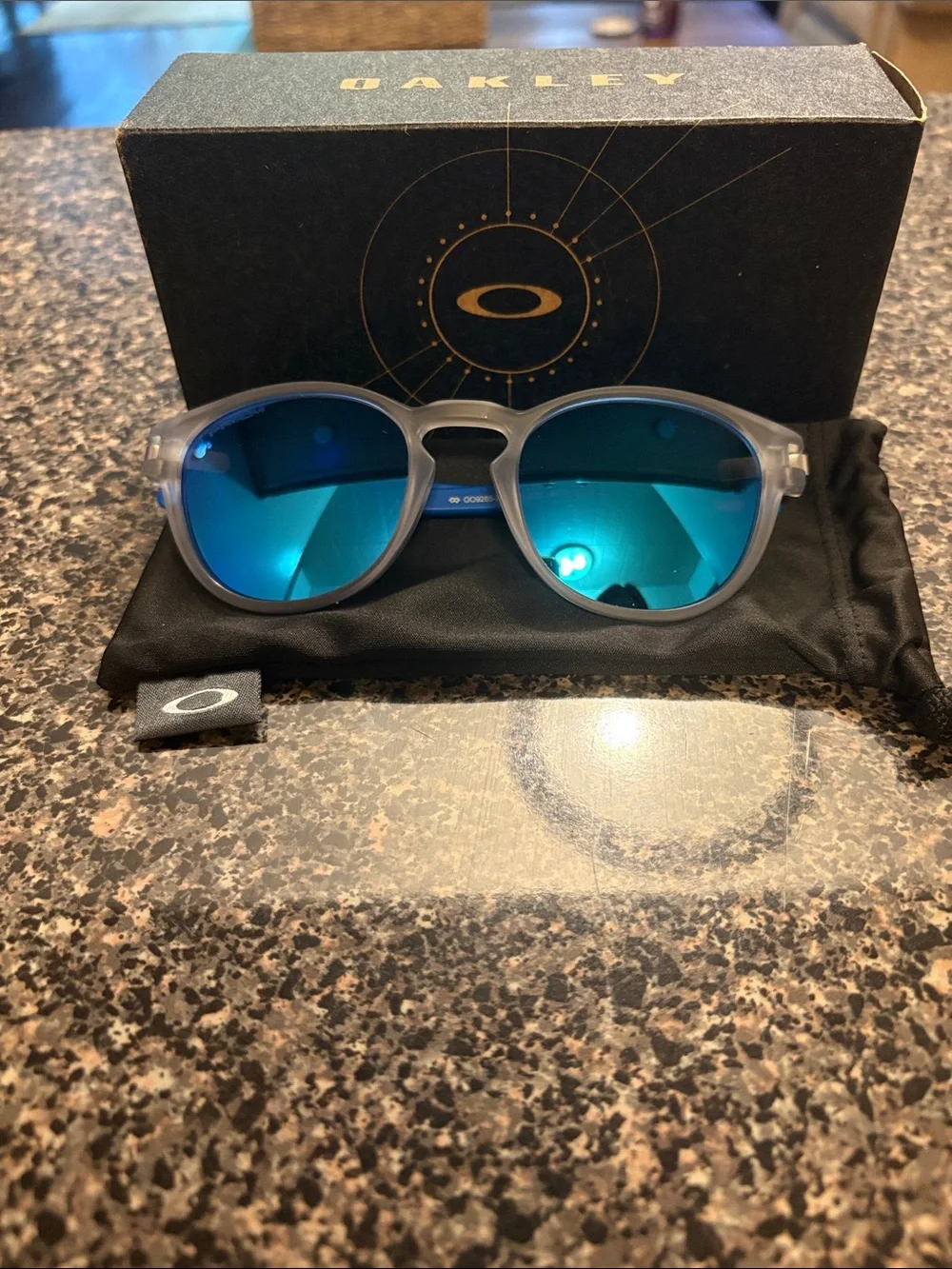Oakley Round Sunglasses Frosted Gray Frames with Blue Mirrored Lenses